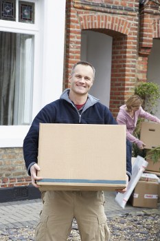 Student removals team handling boxes in a West Brompton residential move