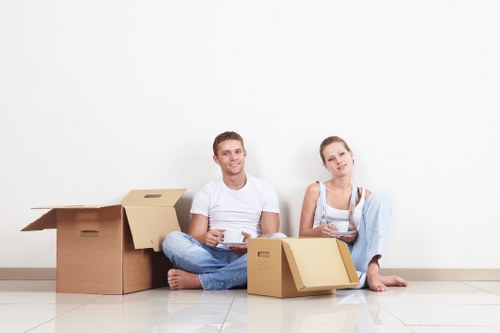 Mover wearing PPE while handling furniture safely