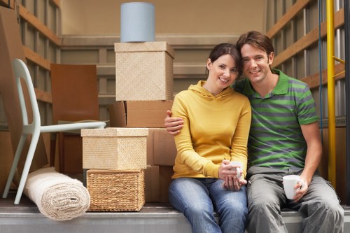 Removal team handling furniture and boxes in Westbrompton