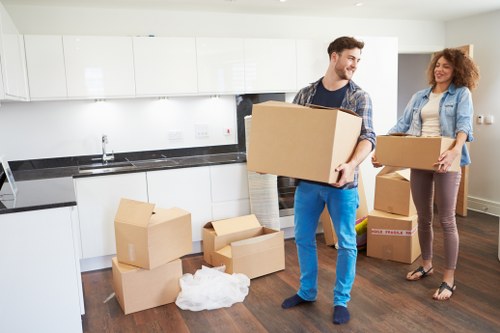 Commercial moving team handling desks and office furniture in West Brompton