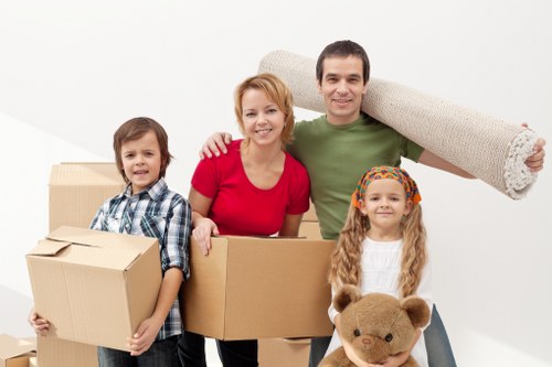 Furniture removal team handling heavy household items in West Brompton