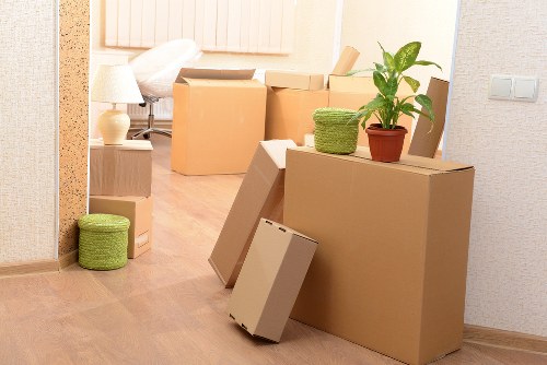 Local movers loading furniture for a same day removals service